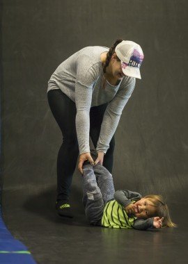 parents and kids on trampolines